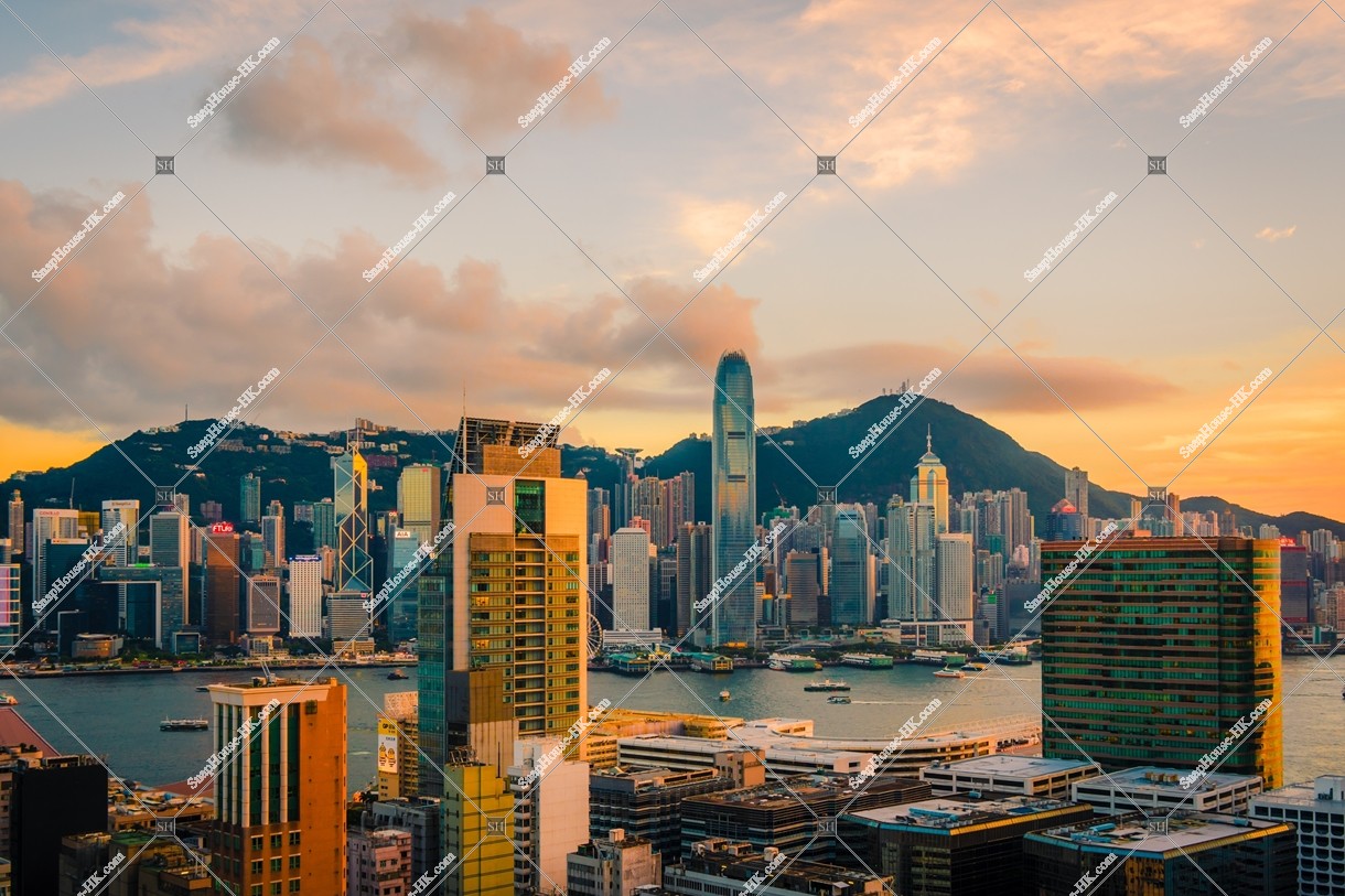 Landscape of the high-rise buildings of Central at sunset, view from Tsim Sha Tsui 