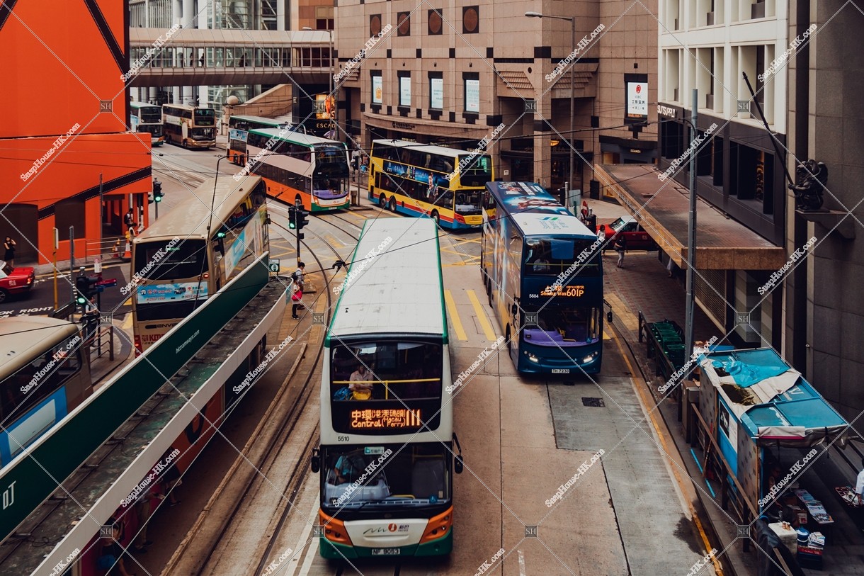 Street view of Des Voeux Road Central with buses at Sheung Wan