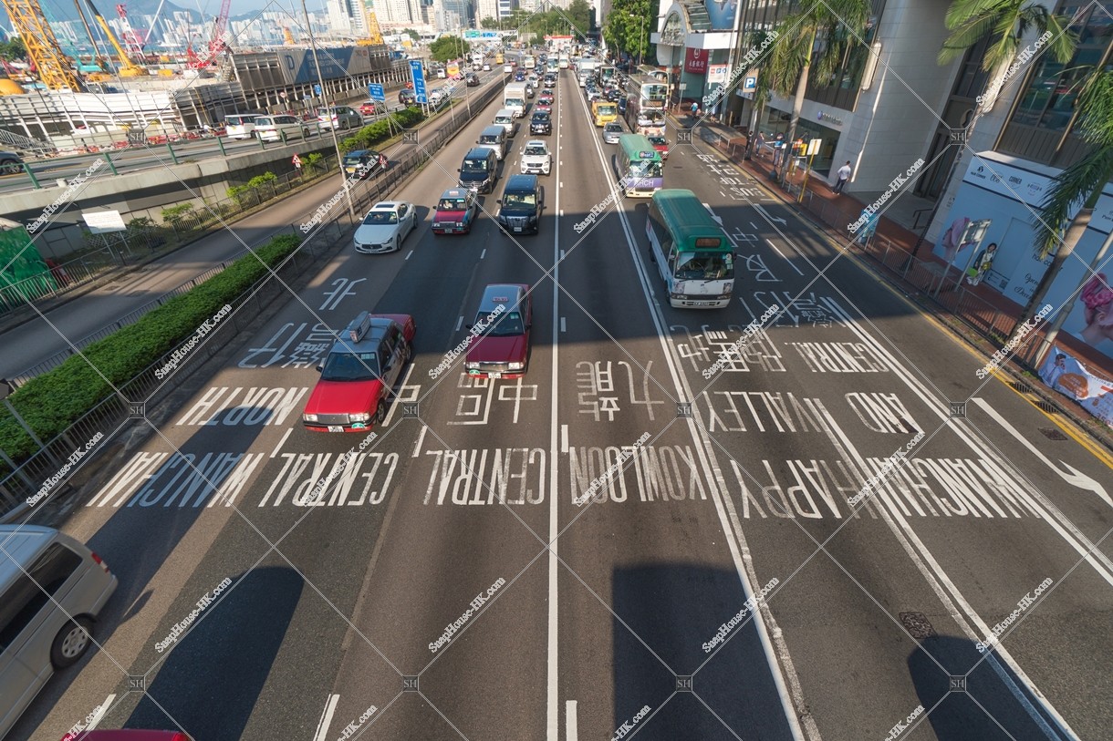 Vehicles driving to Gloucester Road and th Directional sign from various directions