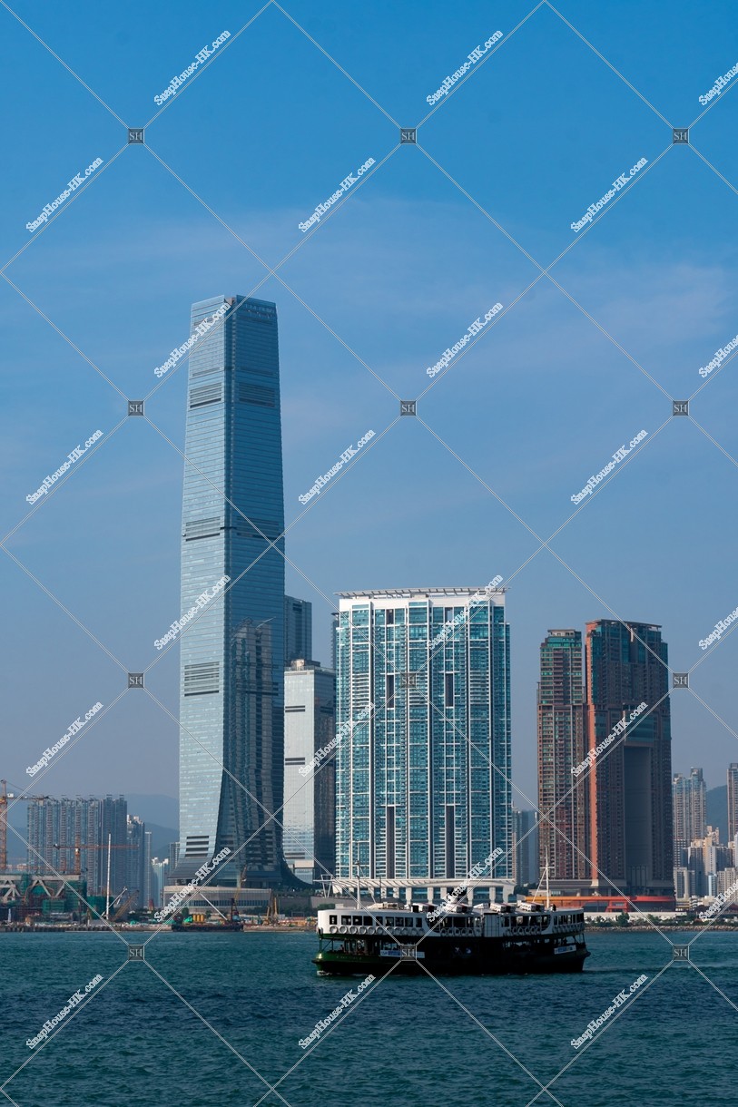 high-rise building and the Star Ferry at West Kowloon