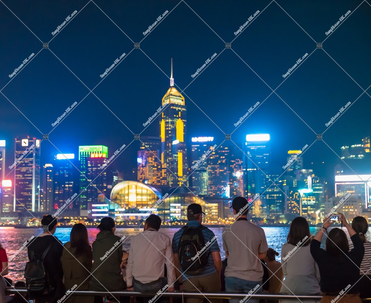People who look at night view of Wan Chai