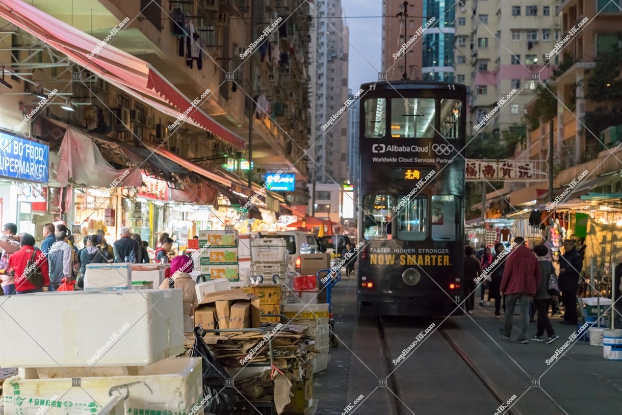 Hong Kong Tramway passing through the shopping street of spring street at night No.2