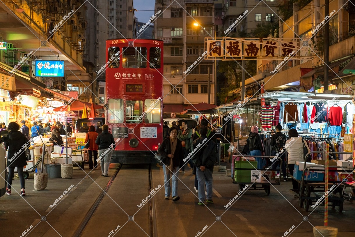 Hong Kong Tramway passing through the shopping street of spring street at night No.5