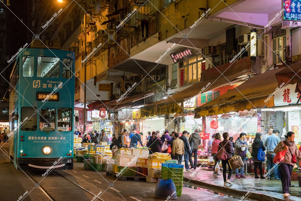 Hong Kong Tramway passing through the shopping street of spring street at night No.6