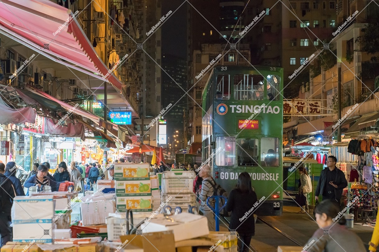Hong Kong Tramway passing through the shopping street of spring street at night No.7