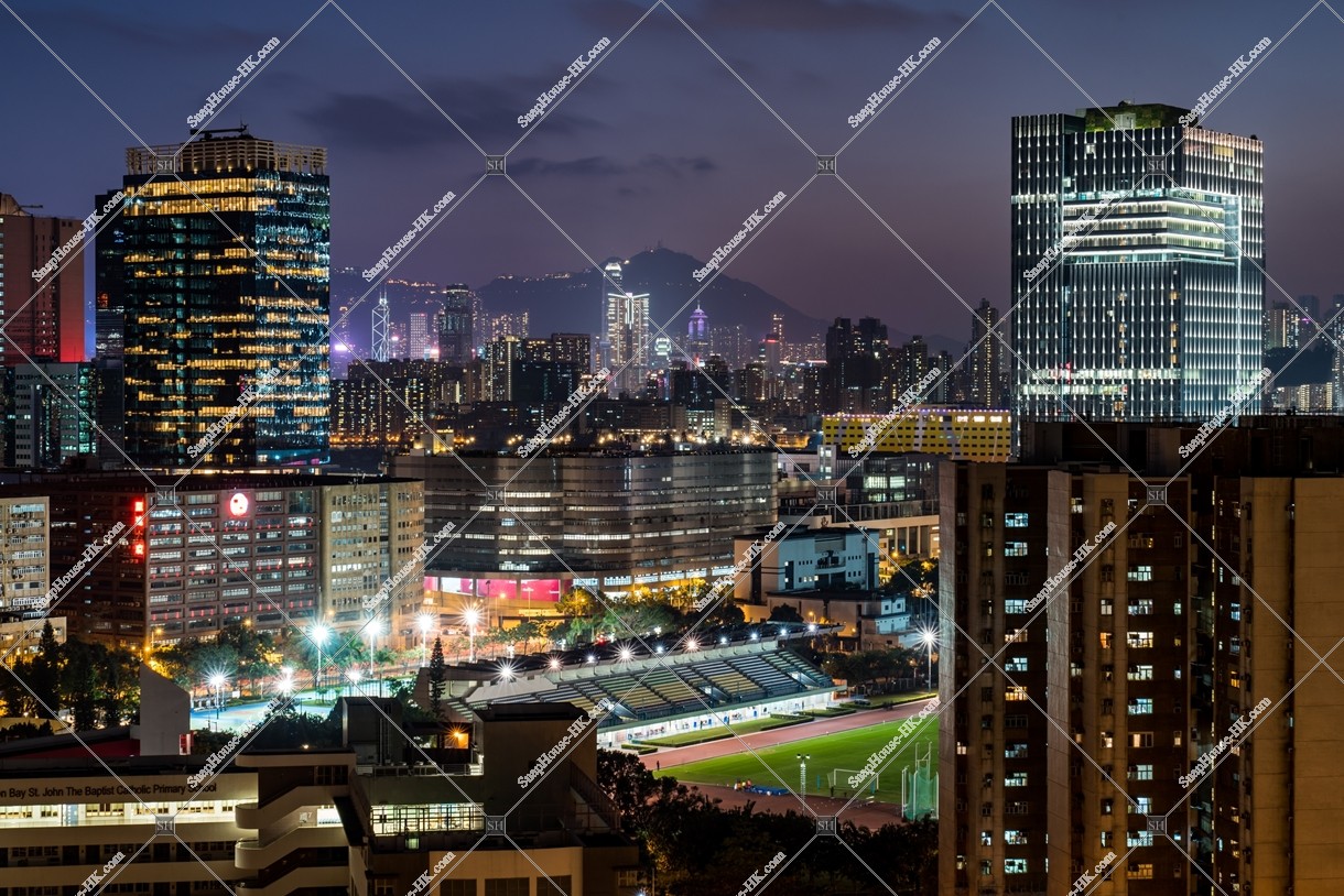 Night view of the buildings and mansions at Kowloon Bay 
