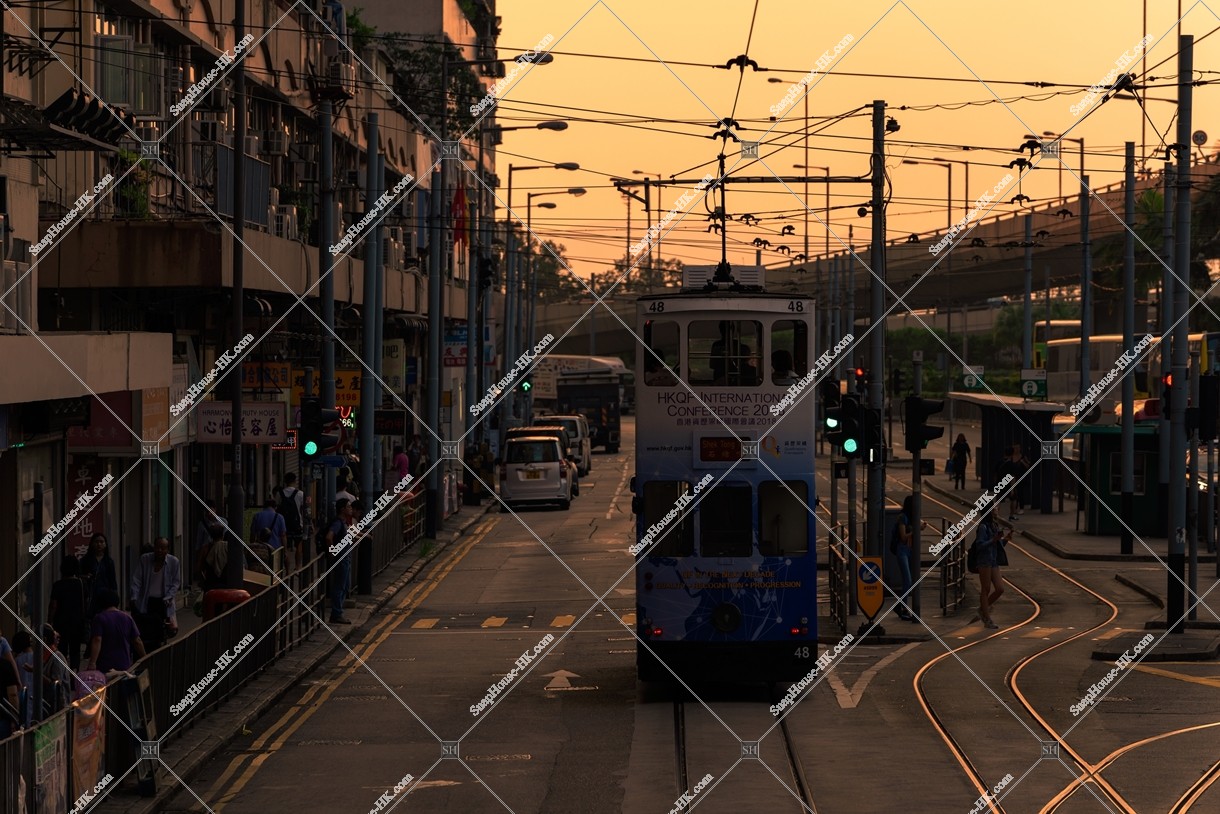 Street view of Sai Wan in the evening with Hong Kong Tramway
