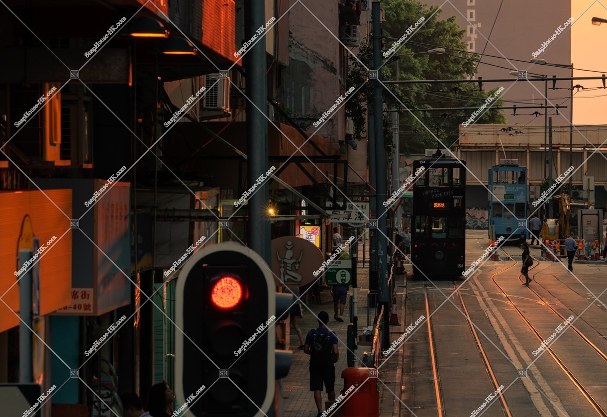 Street view of Kennedy Town in the evening with Hong Kong Tramway, No.3