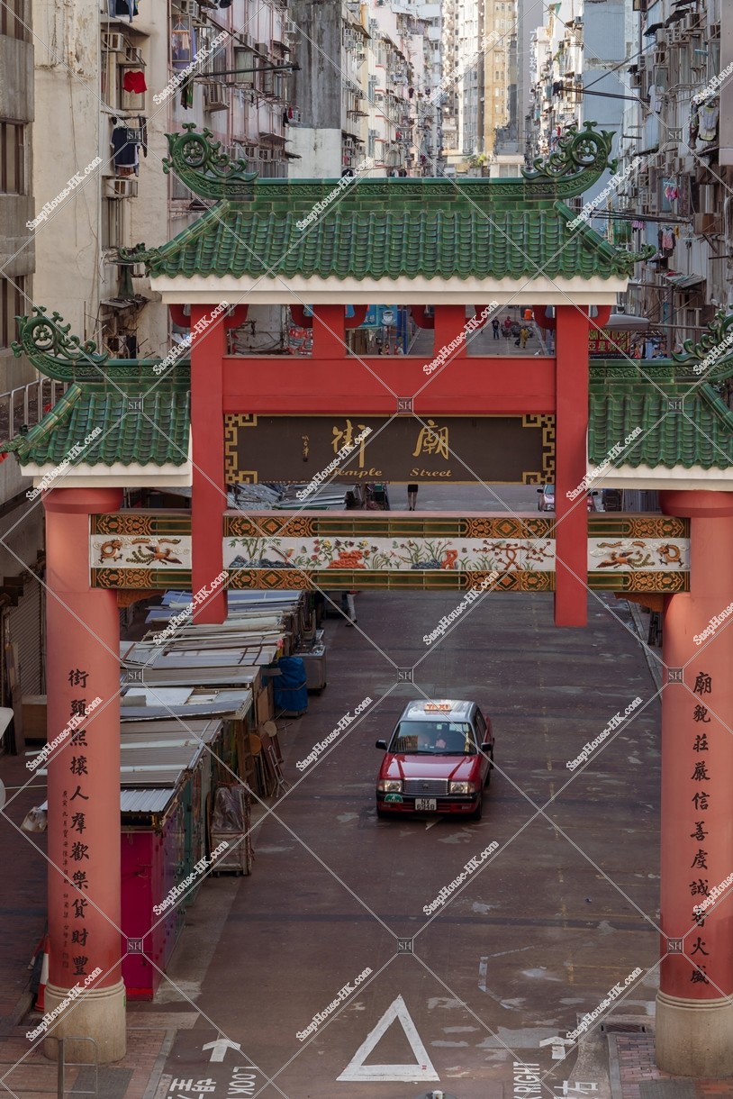 The gate of Temple Street with a taxi in the morning, Jordan