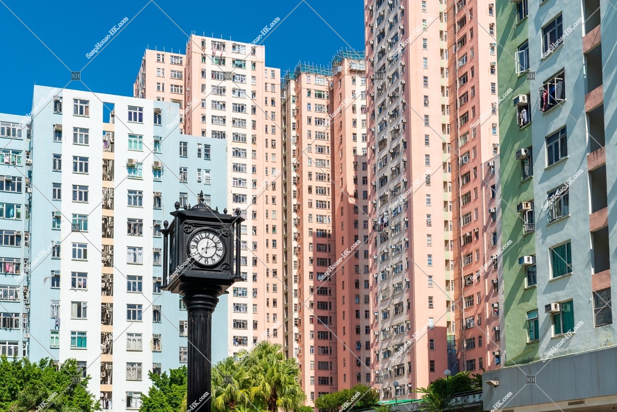 Clock tower and apartment buildings at Kowloon Bay