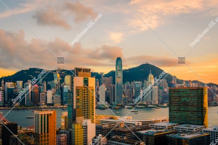 Landscape of the high-rise buildings of Central at sunset, view from Tsim Sha Tsui