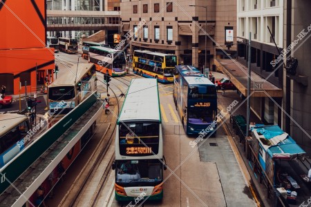 Street view of Des Voeux Road Central with buses at Sheung Wan