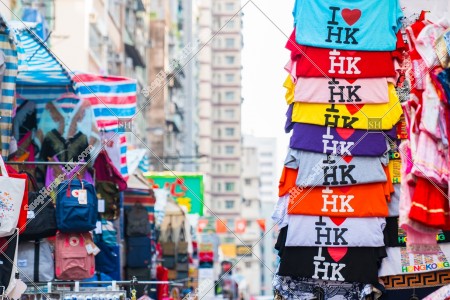 Woman street in Mong Kok  and "I Love HK" T-shirts and stalls standing in line