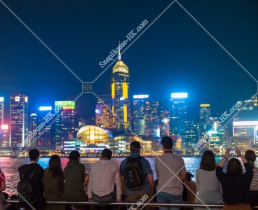 People who look at night view of Wan Chai