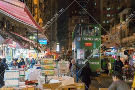 Hong Kong Tramway passing through the shopping street of spring street at night No.7