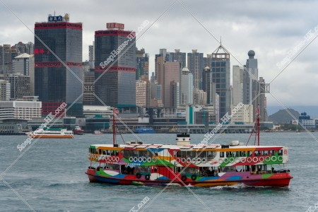 The buildings at Sheung Wan and the Star Ferry on a cloudy day