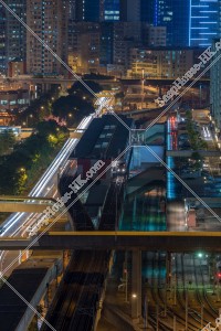 MTR train stopping at Kowloon Bay Station at night