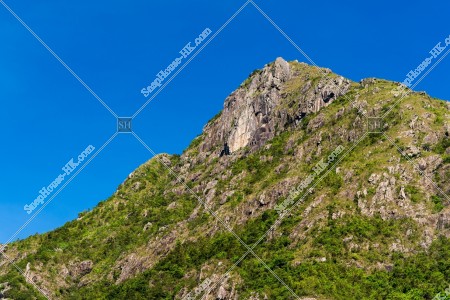Mountain top of Fei Ngo Shan with clear blue sky